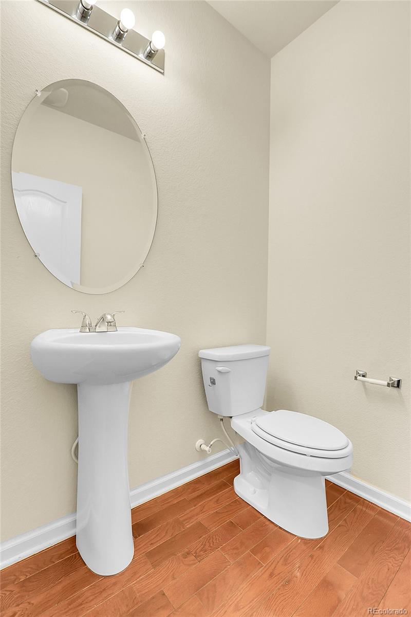 3310 Quicksilver Road Frederick, CO 80516 - Photo 10 of 35 a bathroom with a sink toilet and a mirror