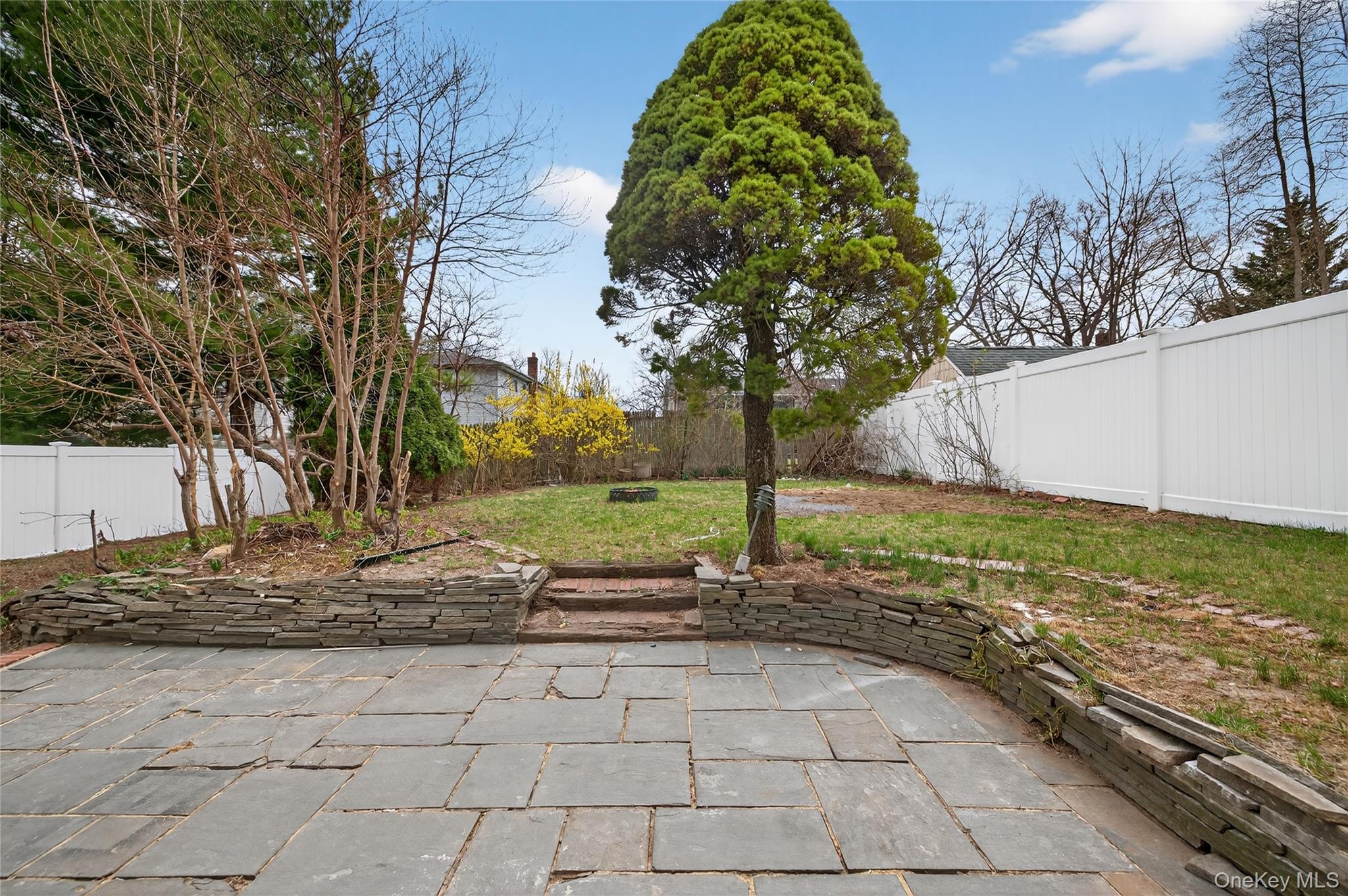 15 Lindsay Street Huntington, NY 11743 - Photo 22 of 23 a view of a backyard with large trees