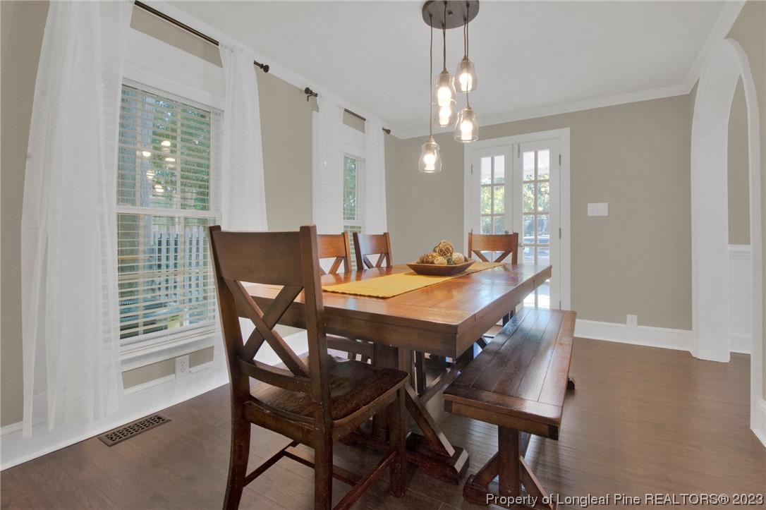 1807 Morganton Road Fayetteville, NC 28305 - Photo 14 of 37 a view of a dining room with furniture window and wooden floor