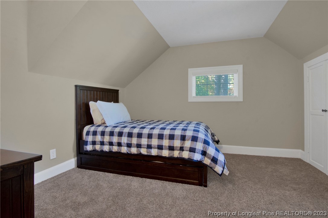 1807 Morganton Road Fayetteville, NC 28305 - Photo 19 of 37 a bedroom with a bed and window