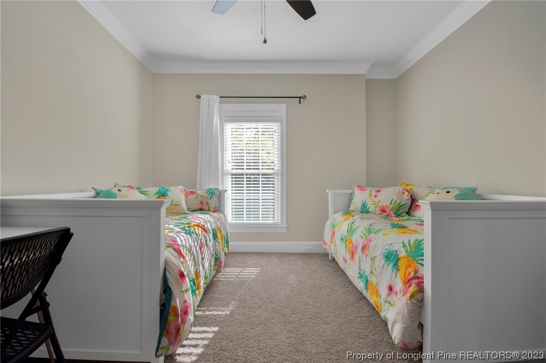 1807 Morganton Road Fayetteville, NC 28305 - Photo 28 of 37 a bedroom with a bed and a window