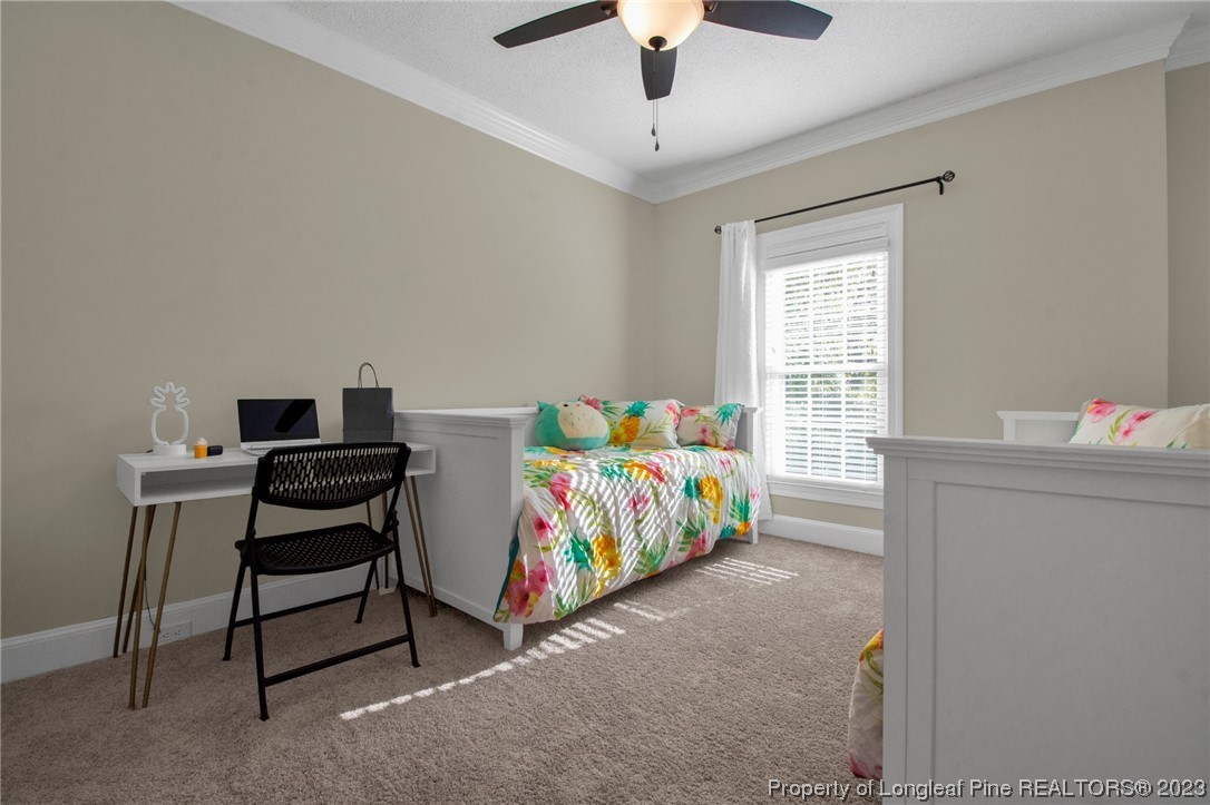 1807 Morganton Road Fayetteville, NC 28305 - Photo 29 of 37 a bedroom with a bed and a window