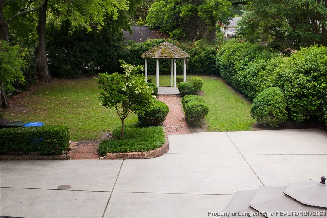 1807 Morganton Road Fayetteville, NC 28305 - Photo 30 of 37 a front view of a house with garden