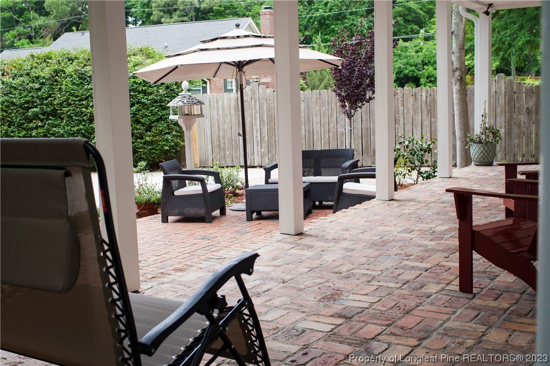 1807 Morganton Road Fayetteville, NC 28305 - Photo 32 of 37 a view of a patio with a table chairs and a table