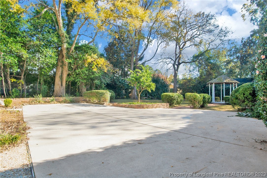 1807 Morganton Road Fayetteville, NC 28305 - Photo 35 of 37 a house with trees in front of it