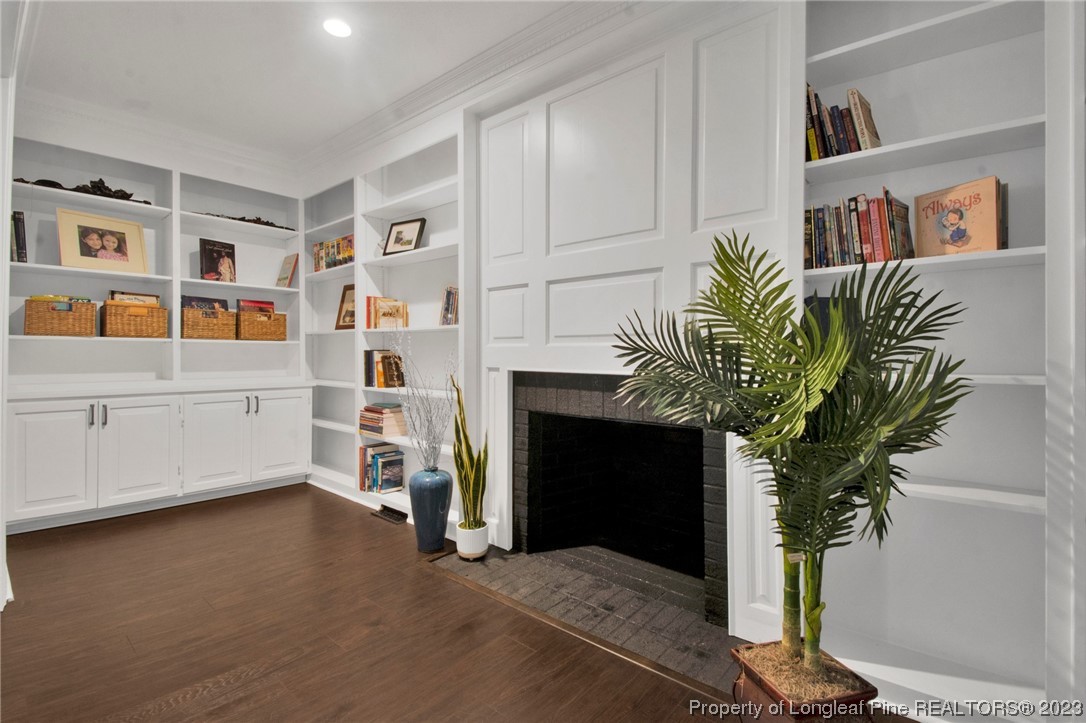 1807 Morganton Road Fayetteville, NC 28305 - Photo 6 of 37 a living room with furniture and a potted plant