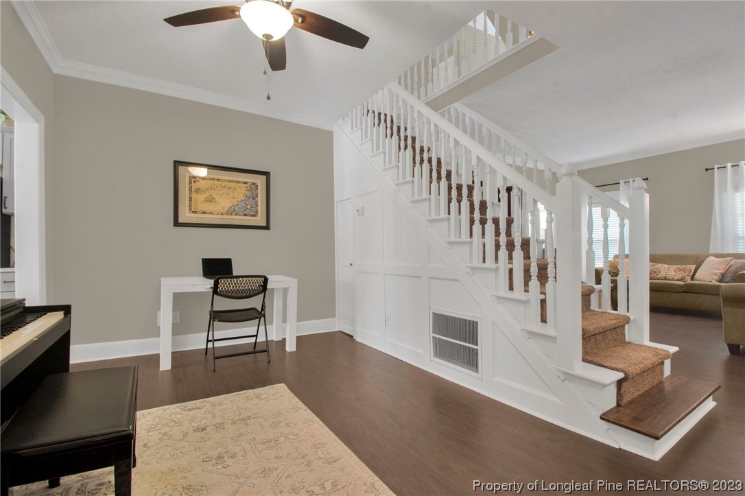 1807 Morganton Road Fayetteville, NC 28305 - Photo 7 of 37 a living room with fireplace furniture and a wooden floor