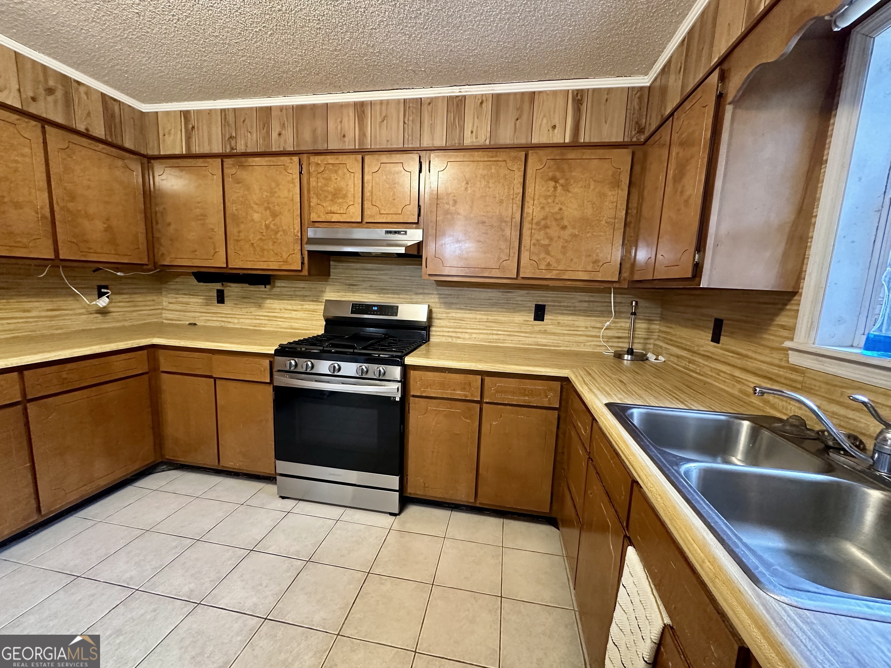 74 Community Church Road McRae-Helena, GA 31037 - Photo 14 of 24 a kitchen with a sink a stove and cabinets