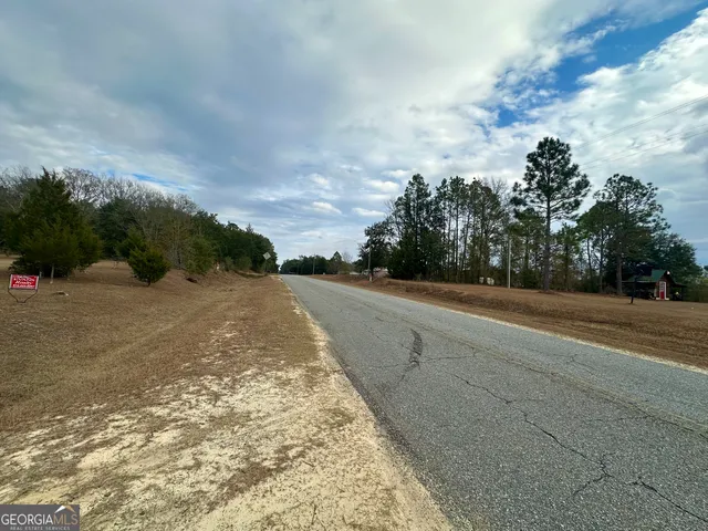 a view of a road with a yard