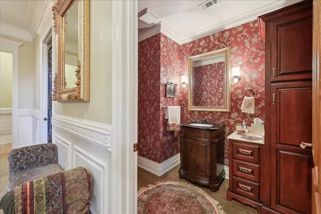 a spacious bedroom with a bed and a television