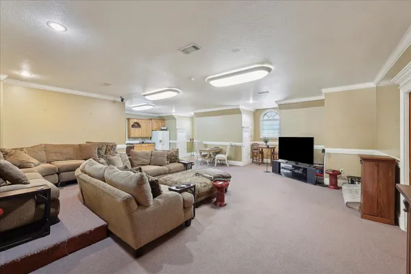 a view of a workspace with furniture and window