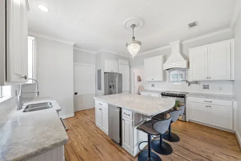 a utility room with sink dryer and washer