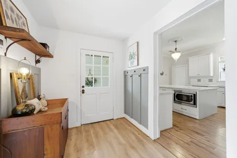 a bedroom with a large bed couch and a window