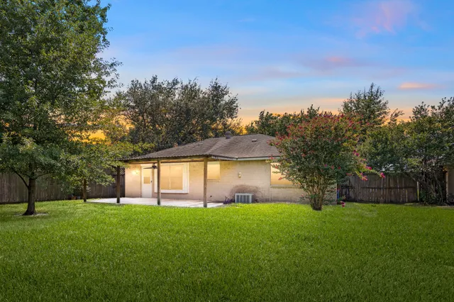an aerial view of a pool and chairs