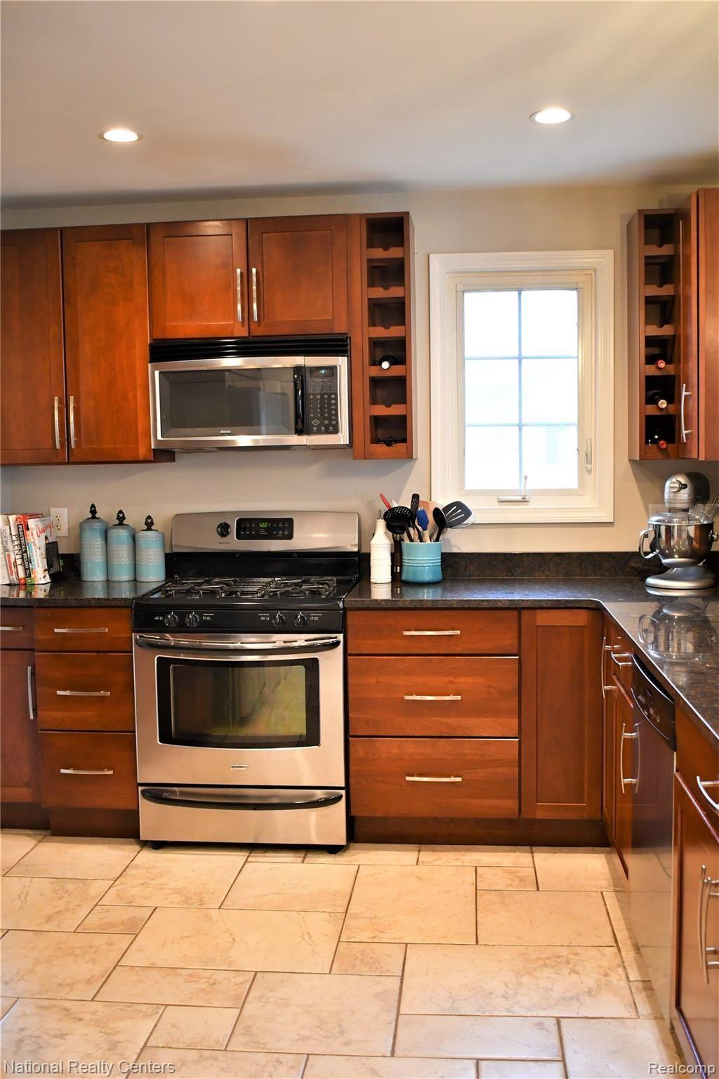4112 Wakefield Road Berkley, MI 48072 - Photo 4 of 42 Updated with granite counters, Merrilat cherry shaker cabinets & stainless steel appliances