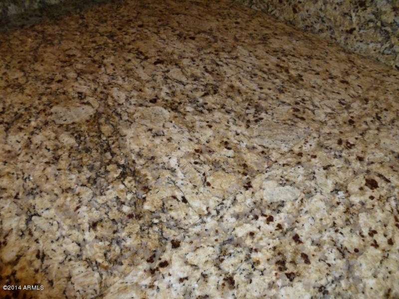 3935 East Rough Rider Road, Unit 1149 Phoenix, AZ 85050 - Photo 18 of 27 Warm granite.