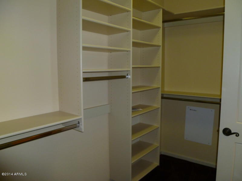 3935 East Rough Rider Road, Unit 1149 Phoenix, AZ 85050 - Photo 27 of 27 Master bed closets