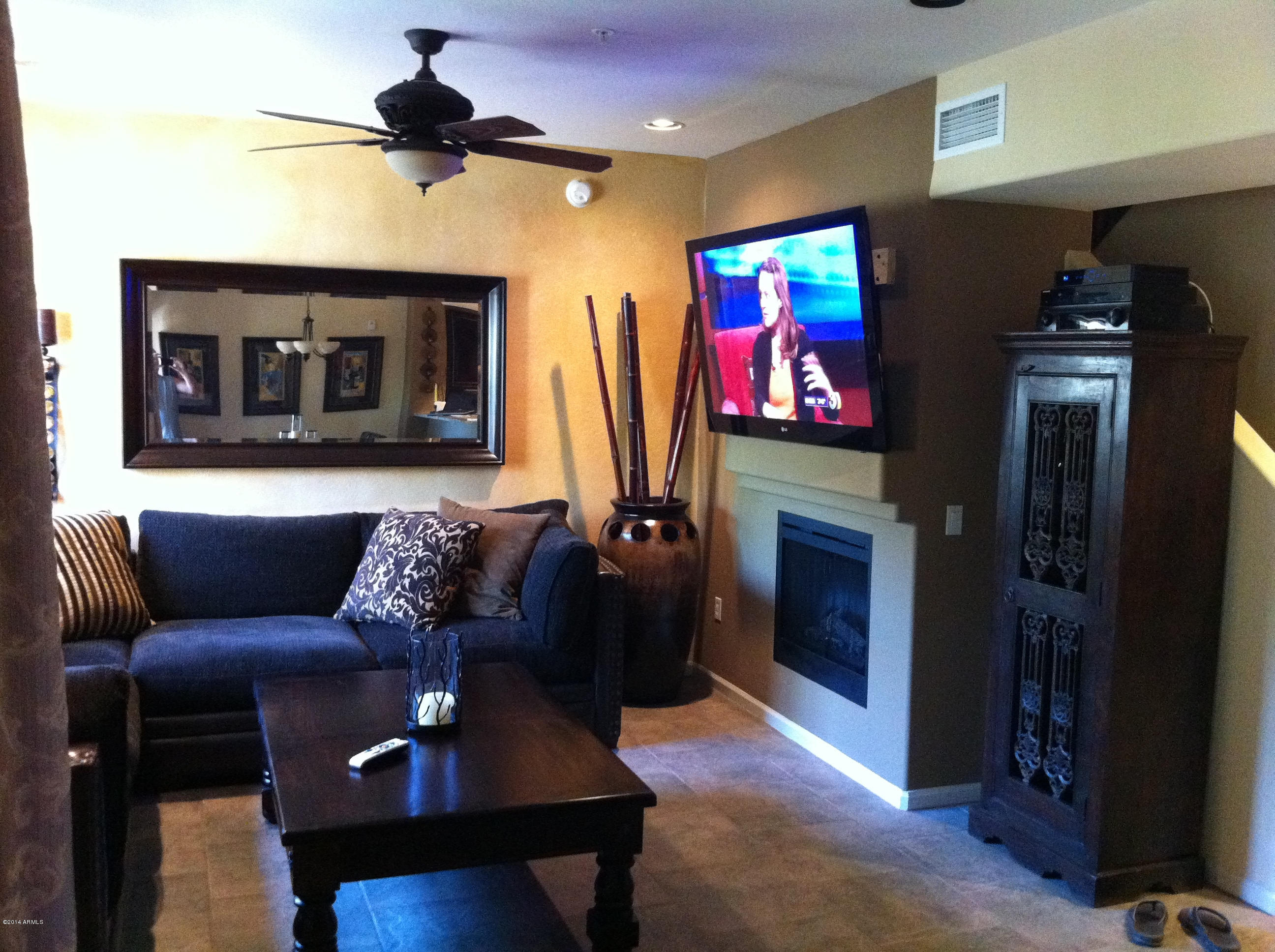 3935 East Rough Rider Road, Unit 1149 Phoenix, AZ 85050 - Photo 10 of 27 Living room w/ Fireplace