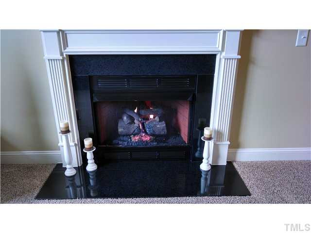 116 Kinloss Way Stem, NC 27581 - Photo 6 of 22 Cozy fireplace in living room