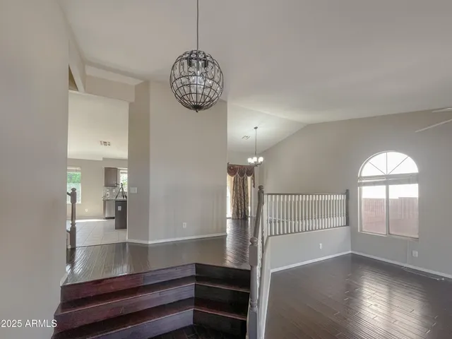 a view of livingroom and kitchen with wooden floor