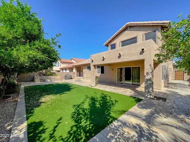 a front view of a house with a yard and porch
