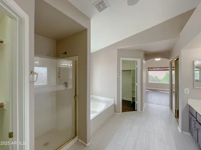 wooden floor with a bathroom