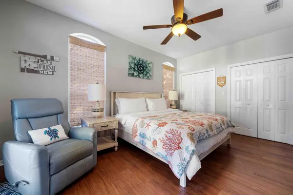 a bedroom with a bed couch and window