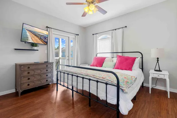 a bedroom with a bed and a chandelier