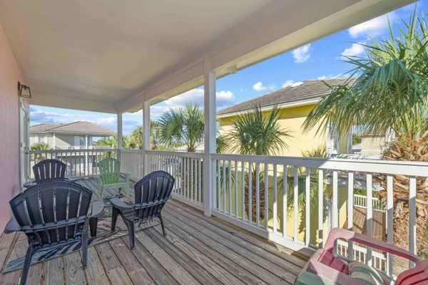 a view of a balcony with furniture