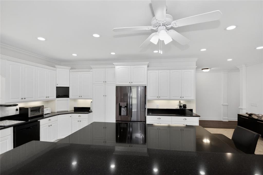 4113 Ledan Extension Gainesville, GA 30506 - Photo 63 of 195 a kitchen with stainless steel appliances kitchen island granite countertop a refrigerator and a stove top oven