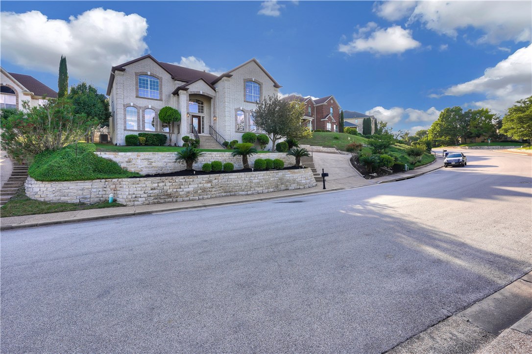 a front view of house with a yard and outdoor seating