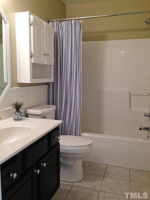 1806 Patterson Grove Road Apex, NC 27502 - Photo 17 of 25 Hall Bath, nicely updated, tile floor, wainscoting, super clean!