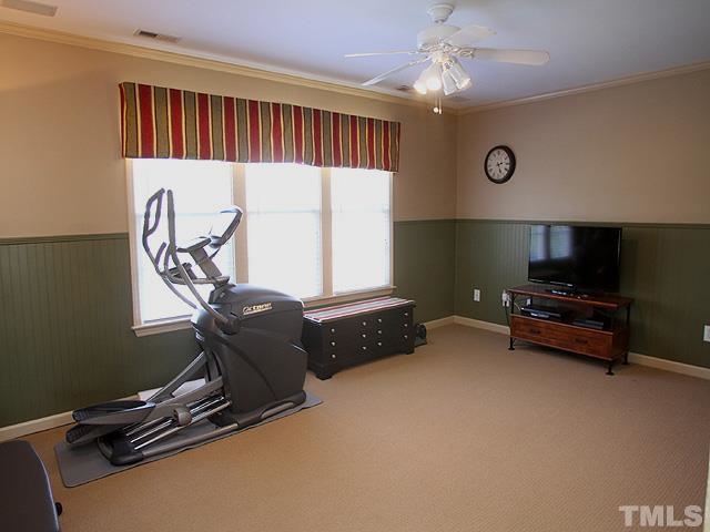 1806 Patterson Grove Road Apex, NC 27502 - Photo 18 of 25 Currently a home gym but would make a great second family room. Berber carpet here and leading up the stairs to the finished attic/office area.