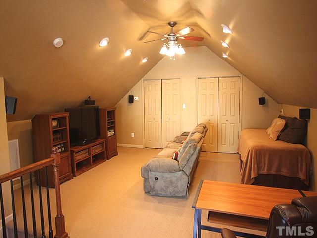 1806 Patterson Grove Road Apex, NC 27502 - Photo 19 of 25 Attic is much larger that the photo allows us to see! There is a partial kitchen with cabinetry, counter, and outlets for a small refrigerator and microwave behind where the photo is taken. Multiple uses for this space, and great closets too!