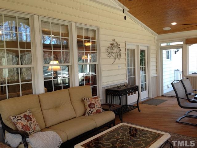 1806 Patterson Grove Road Apex, NC 27502 - Photo 21 of 25 Another view of the spacious screen porch. Notice the dual ceiling fans and recessed can lighting. Huge window space with "super screen" allows a great view of the back yard and green area behind the home.