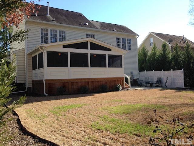 1806 Patterson Grove Road Apex, NC 27502 - Photo 23 of 25 Nice view of the fenced back yard, rear of the home and the extensive patio area. This home was made for entertaining!