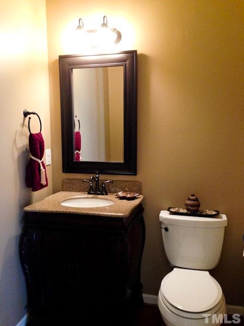 1806 Patterson Grove Road Apex, NC 27502 - Photo 6 of 25 Bath has been remodeled with custom cabinetry, mirror, lighting and faucet.