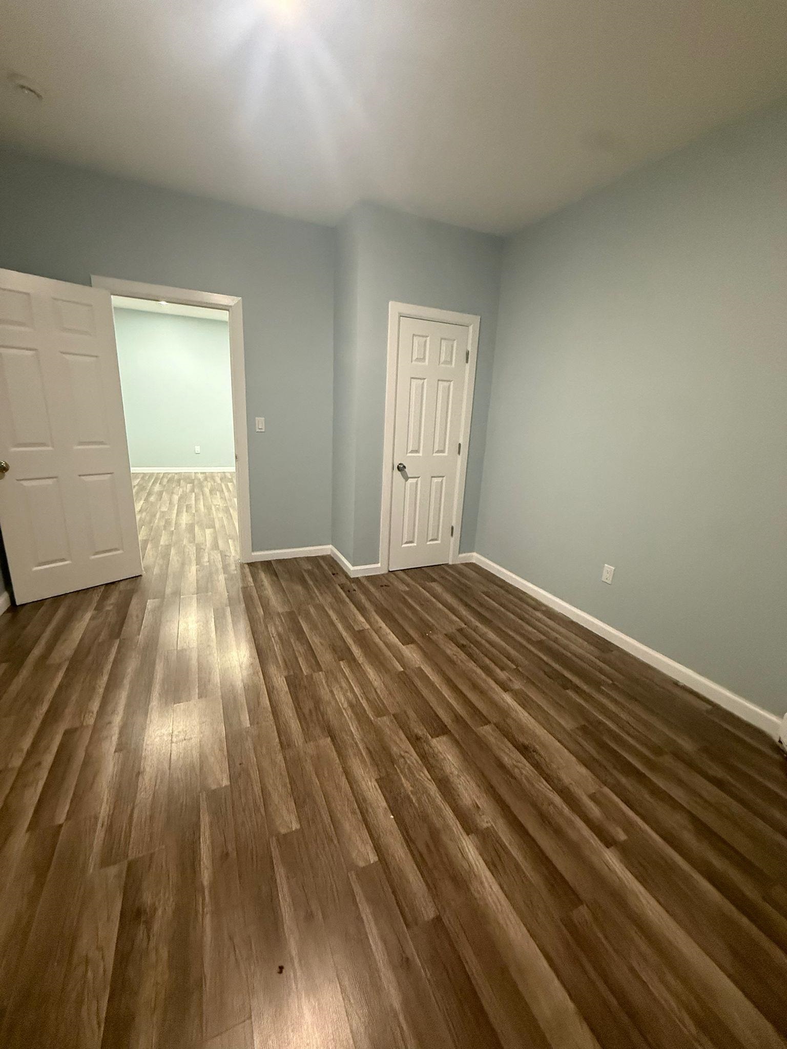 100 Rosa Parks Boulevard, Unit 1 Paterson, NJ 07501 - Photo 10 of 14 a view of wooden floor in a room