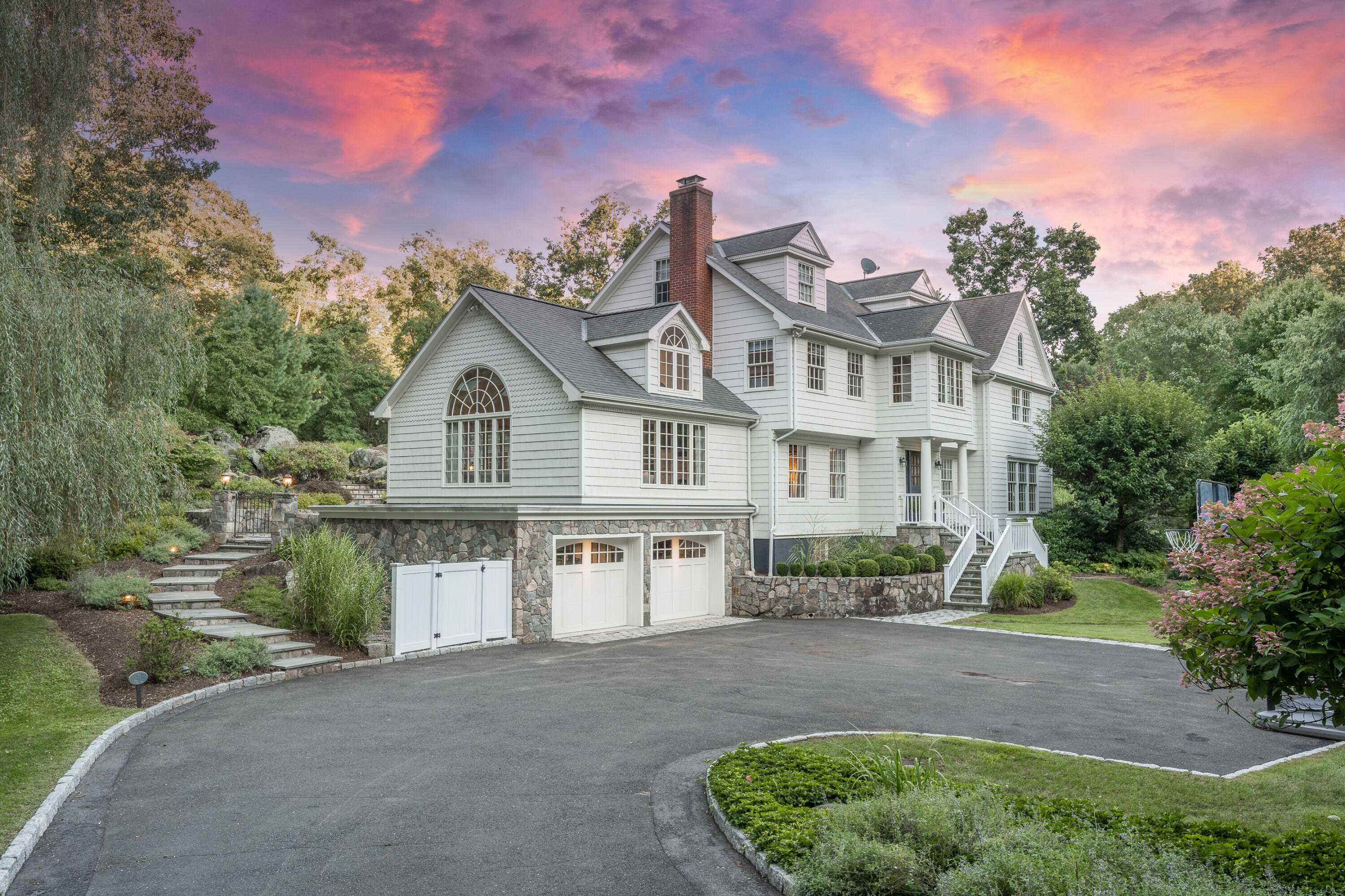 41 Delafield Island Road Darien, CT 06820 - Photo 2 of 30 a front view of a house with a yard and lake view