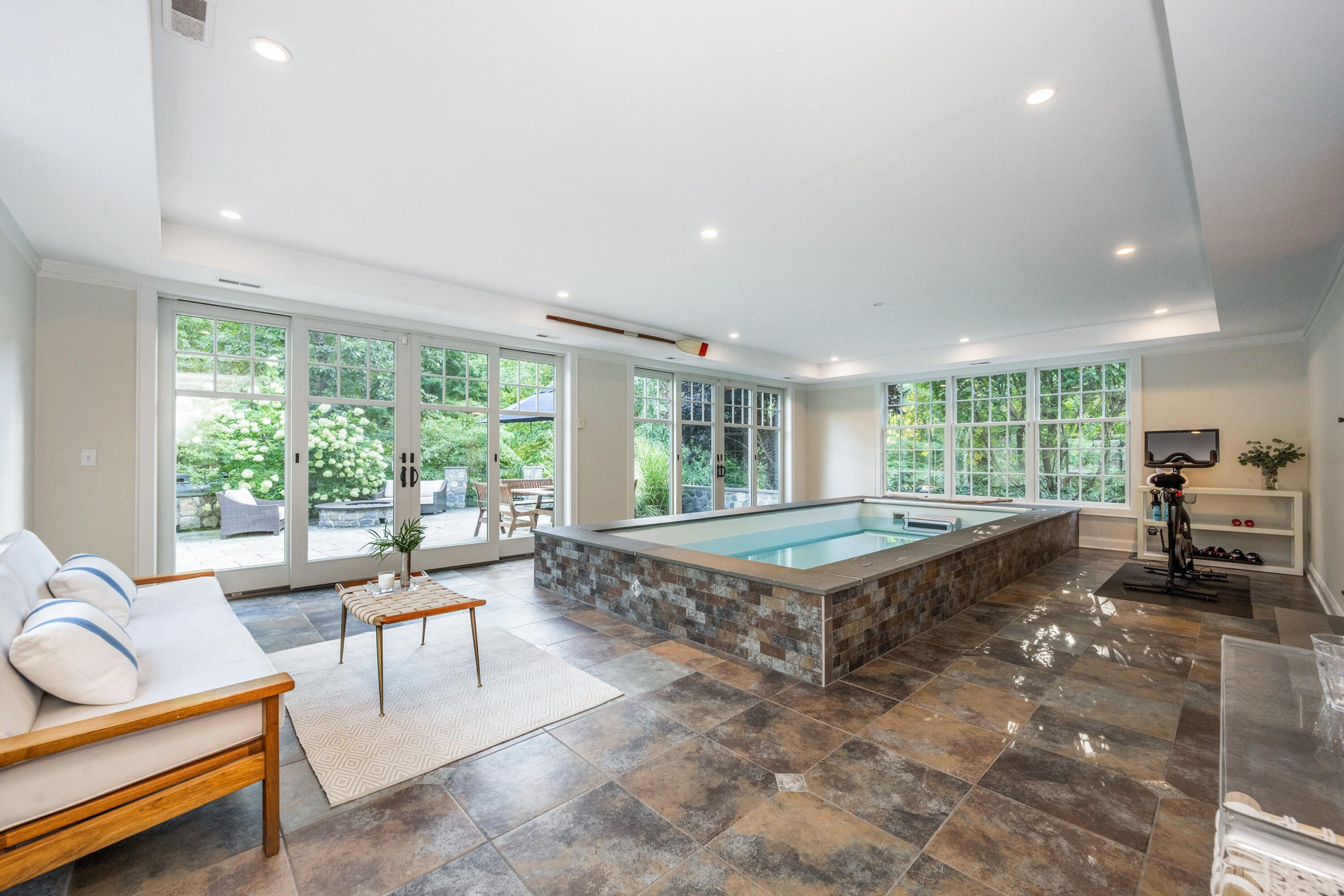 41 Delafield Island Road Darien, CT 06820 - Photo 12 of 30 a living room with furniture stove and large windows