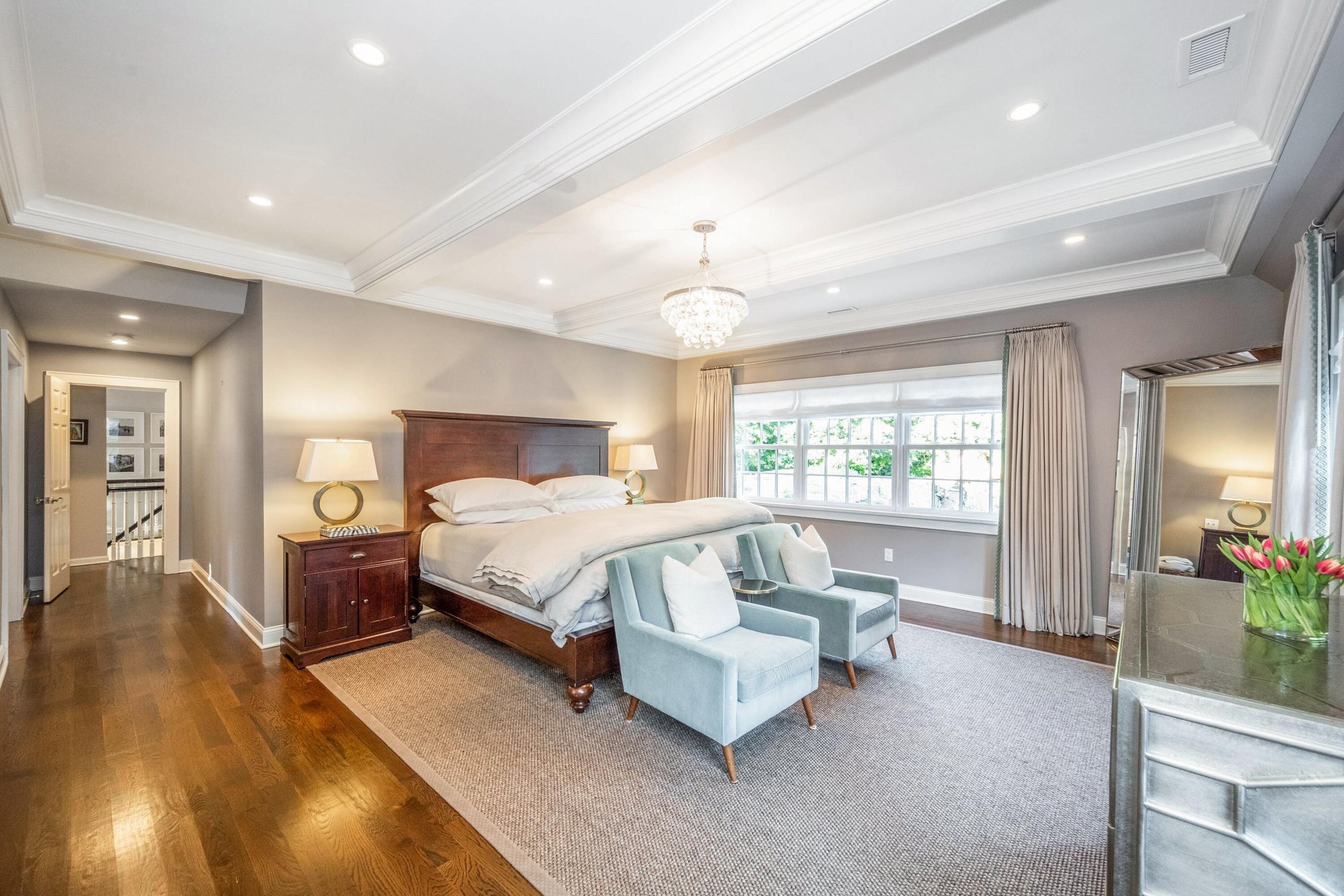 41 Delafield Island Road Darien, CT 06820 - Photo 13 of 30 a spacious bedroom with a bed and window