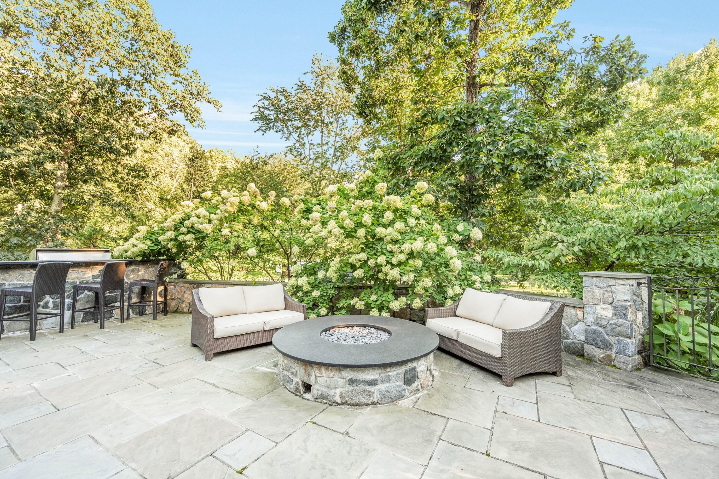 41 Delafield Island Road Darien, CT 06820 - Photo 28 of 30 a view of a patio with a chairs and a table and chairs