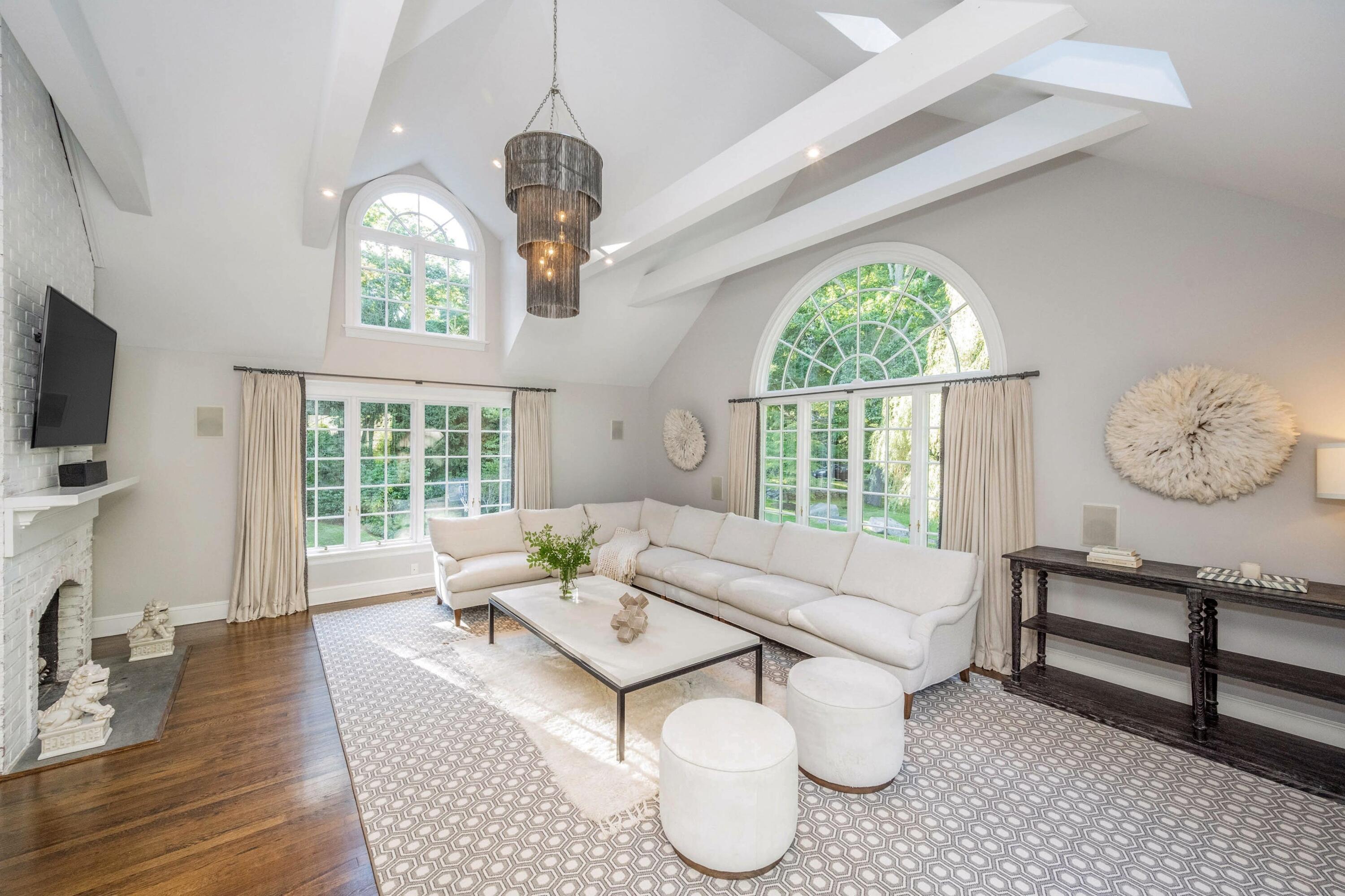 41 Delafield Island Road Darien, CT 06820 - Photo 9 of 30 a living room with furniture a fireplace and a flat screen tv