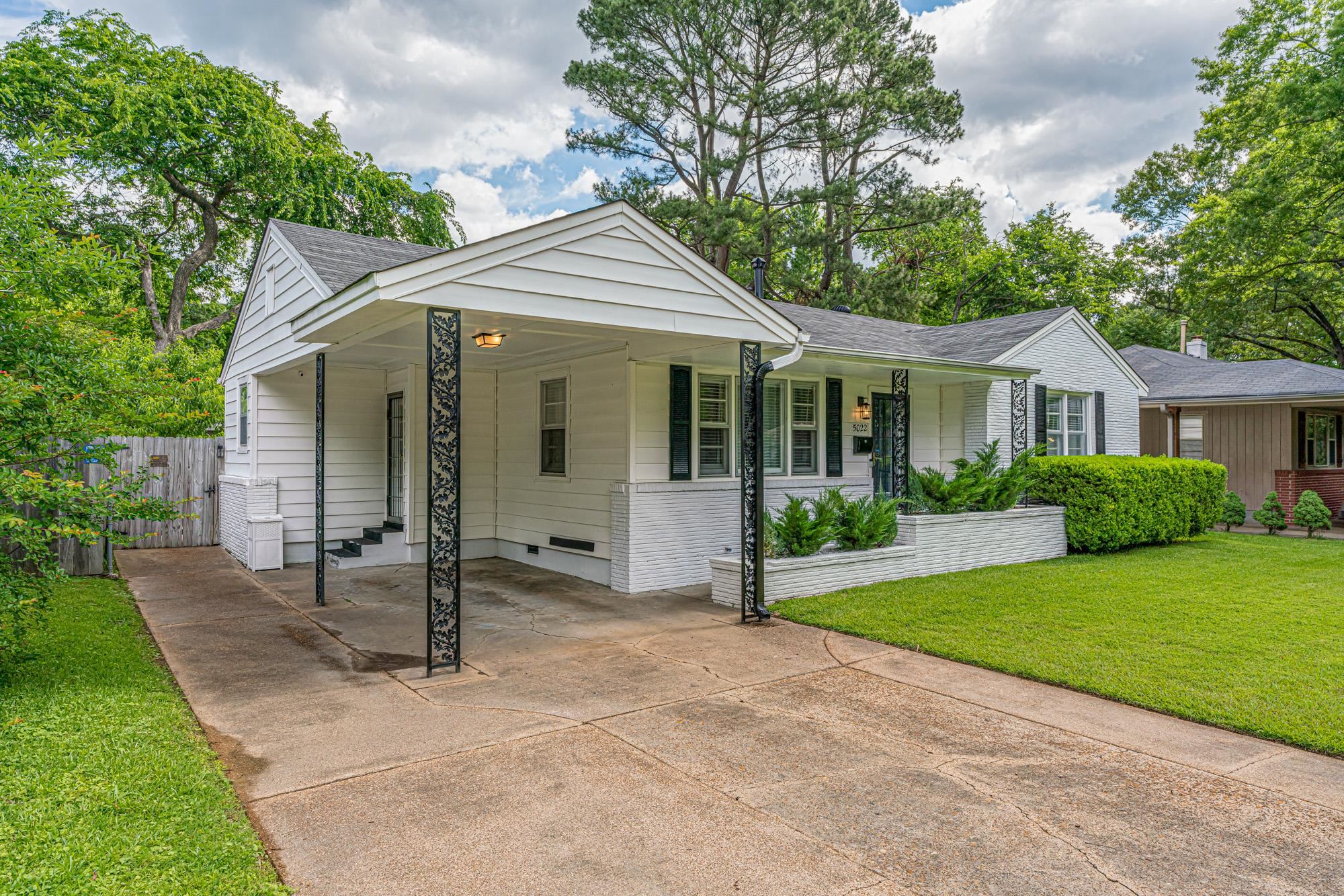 5022 Sequoia Road Memphis, TN 38117 - Photo 3 of 25 a front view of a house with a garden