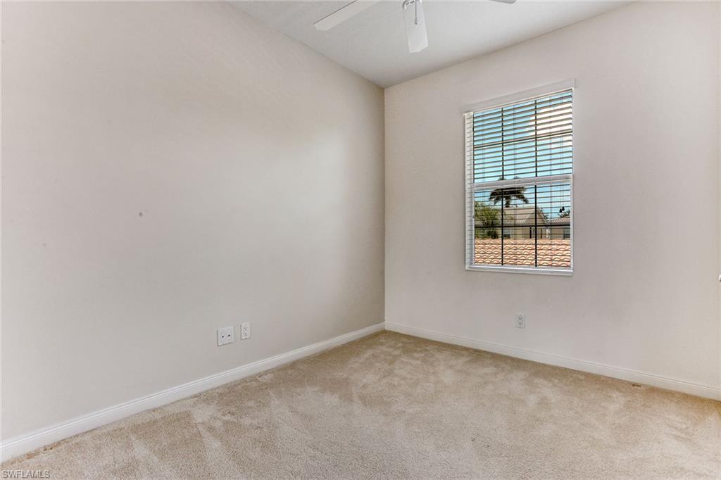 8334 Rimini Way Naples, FL 34114 - Photo 19 of 34 an empty room with windows