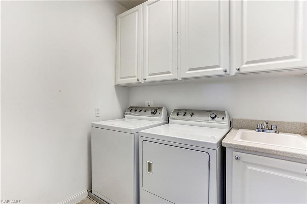 8334 Rimini Way Naples, FL 34114 - Photo 20 of 34 a utility room with dryer and washer