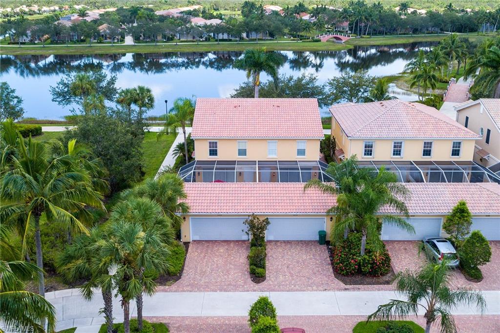 8334 Rimini Way Naples, FL 34114 - Photo 23 of 34 an aerial view of a house with garden space and lake view