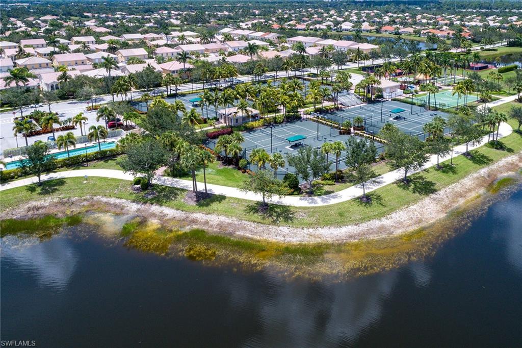 8334 Rimini Way Naples, FL 34114 - Photo 27 of 34 a view of a lake with a city