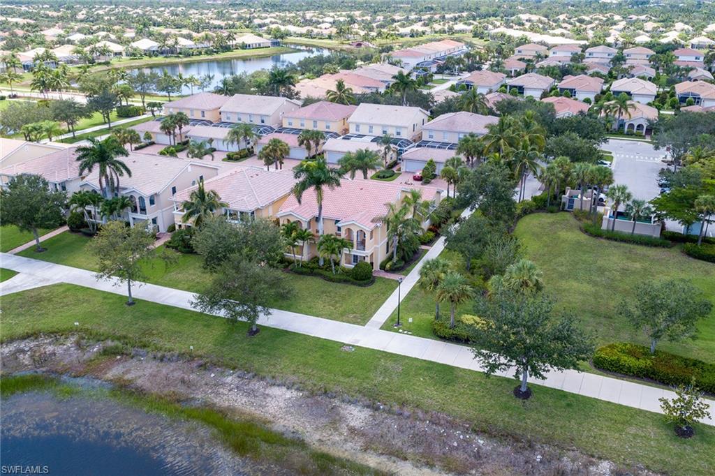 8334 Rimini Way Naples, FL 34114 - Photo 28 of 34 an aerial view of residential houses with outdoor space and street view
