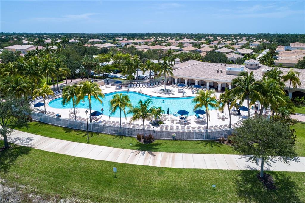 8334 Rimini Way Naples, FL 34114 - Photo 34 of 34 an aerial view of a house with a garden and lake view
